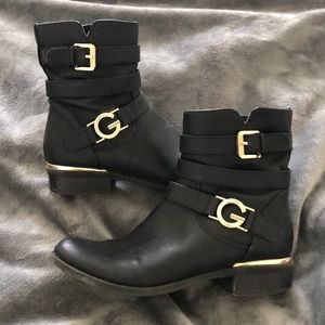 Black Guess booties with gold accents